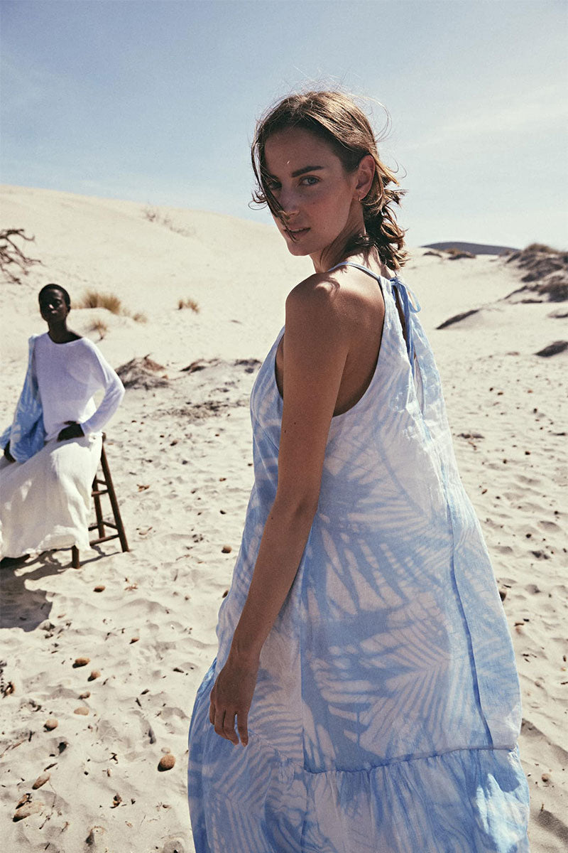 Printed halterneck maxi dress and Cross-strap leather sandals