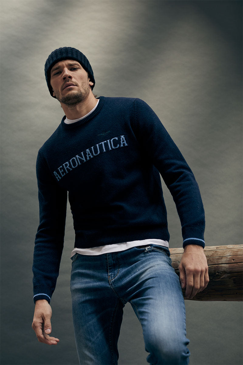Washed-effect wool sweater and Light-wash slim-fit jeans
