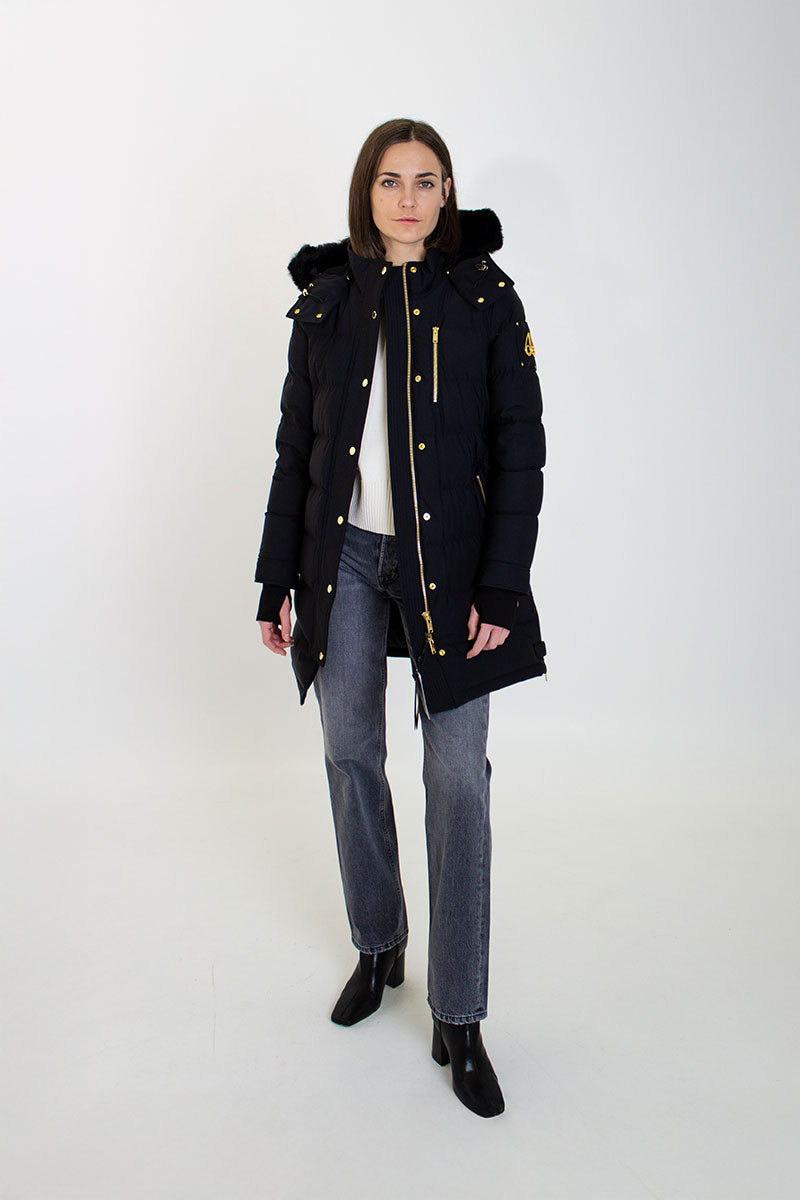Gold-detail down parka WATERSHED and Fur-trim leather boots EXPLORER A300